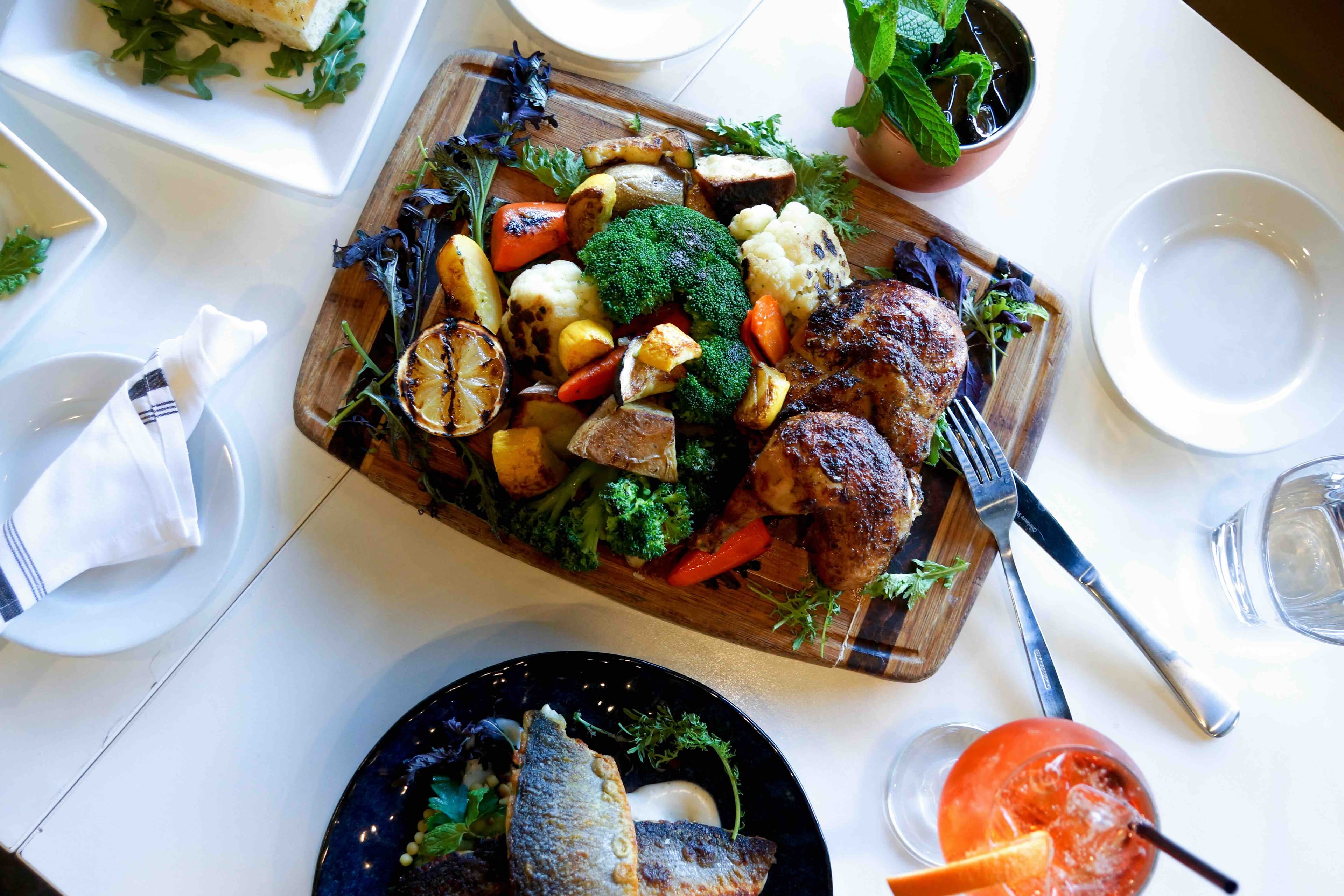 Family-style roasted chicken board and wine at RoVino.